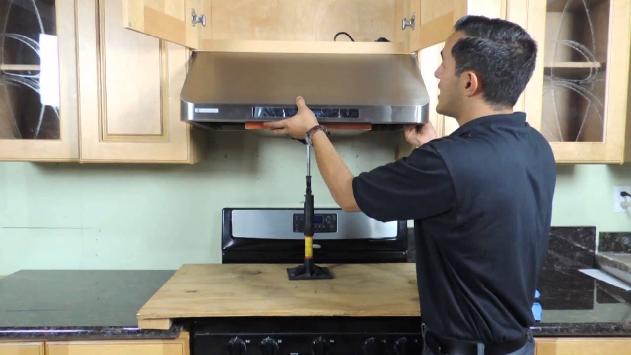 Kitchen hood installer working on commercial extraction system in Aberdeen