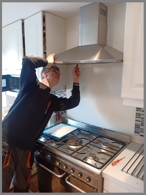 Kitchen hood installer in Aberdeen working safely on commercial ventilation